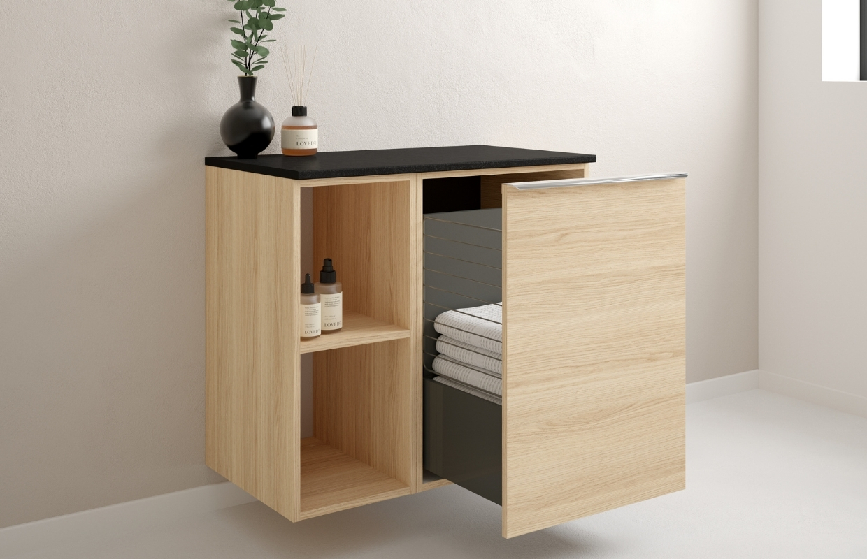 Meble do łazienki w kolorze dąb vicenza - szuflada z koszem oraz kubik zabudowane wspólnym blatem.